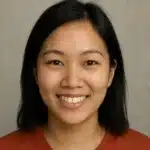 Young Singaporean woman smiling confidently, representing a satisfied travel insurance customer